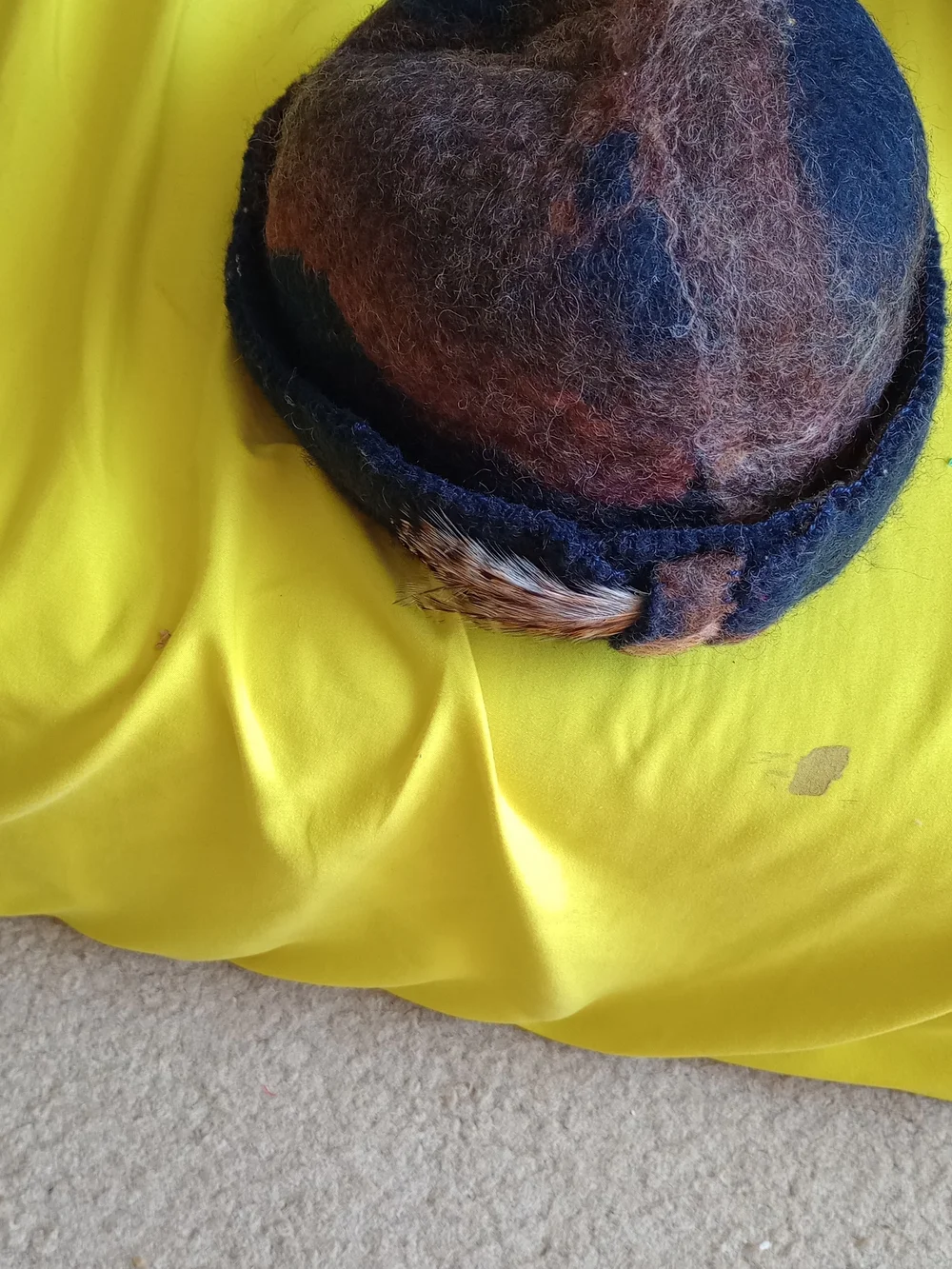 Sgailean handmade blue and rust-colored felted wool cloche hat.